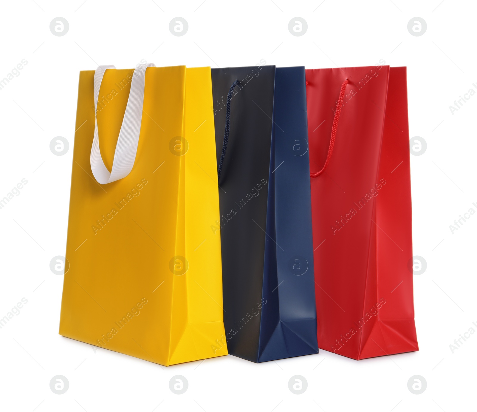 Photo of Colorful paper shopping bags isolated on white