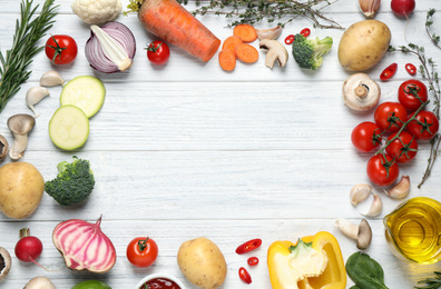 Photo of Flat lay composition with fresh products on white wooden table, space for text. Healthy cooking