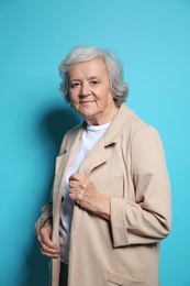 Photo of Portrait of elderly woman on color background