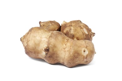 Photo of Three raw Jerusalem artichokes isolated on white