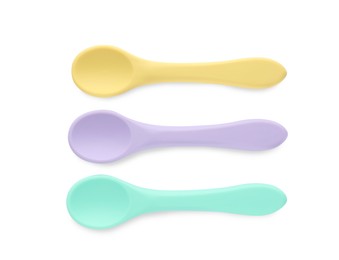 Photo of Plastic spoons isolated on white, top view. Serving baby food
