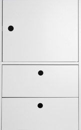 Photo of White wardrobe drawers as background, closeup view