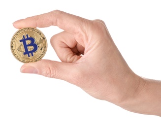 Photo of Woman holding golden bitcoin on white background, closeup