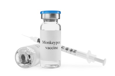Photo of Monkeypox vaccine in glass vials and syringe on white background