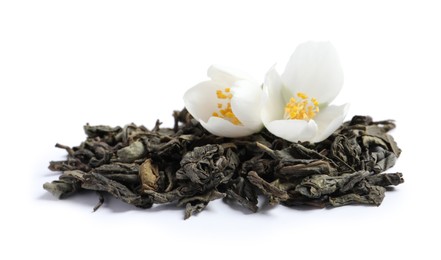Photo of Dry tea leaves and fresh jasmine flowers on white background