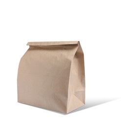 Image of New closed paper bag on white background