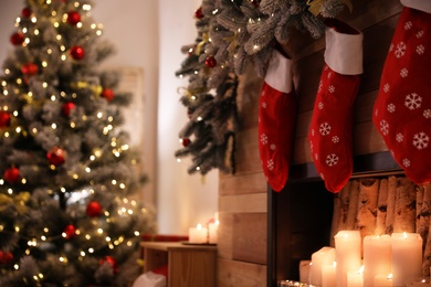 Photo of Stylish room interior with decorative fireplace. Christmas time