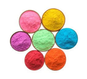 Photo of Colorful powders in bowls on white background, top view. Holi festival celebration