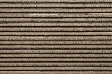 Photo of Lined grey concrete as background, top view. Tile installation