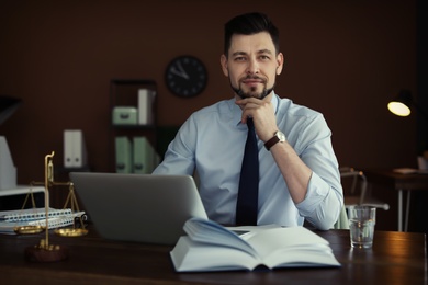 Photo of Male lawyer working in office