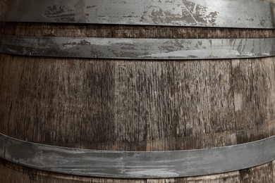Photo of Traditional wooden barrel as background, closeup. Wine making