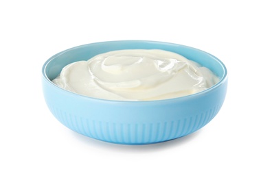 Photo of Bowl with sour cream on white background