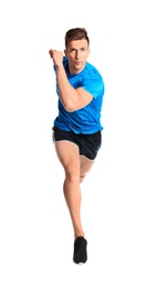 Sporty young man running on white background