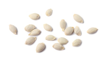 Photo of Many seeds of tangerine isolated on white, top view