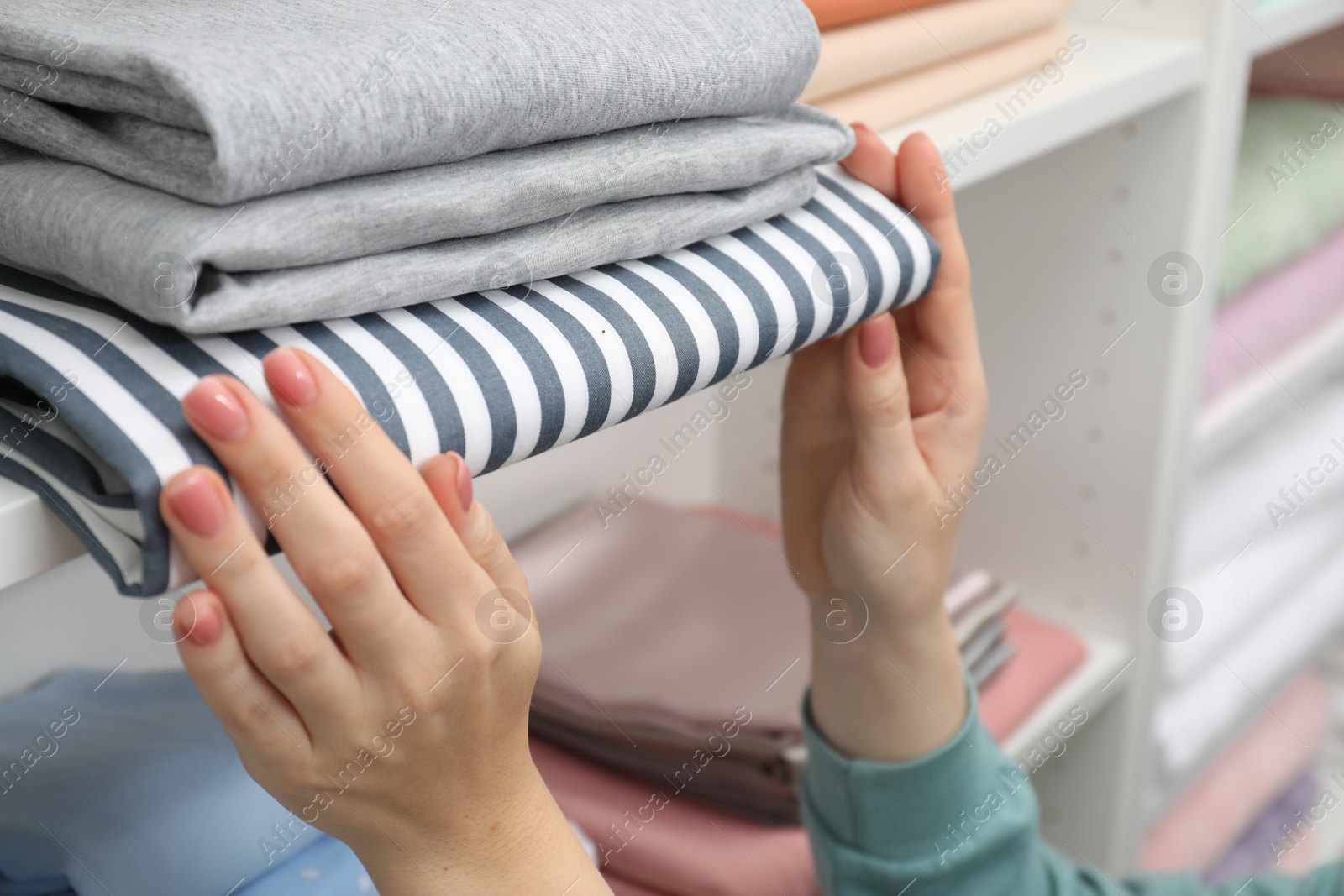 Customer choosing bed linens in shop, closeup Photo of Customer choosing bed linens in shop, closeup