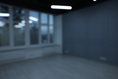 Photo of Blurred view of new empty room with windows