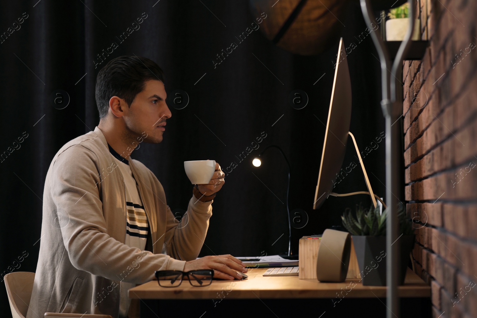 Photo of Journalist working with modern computer in office