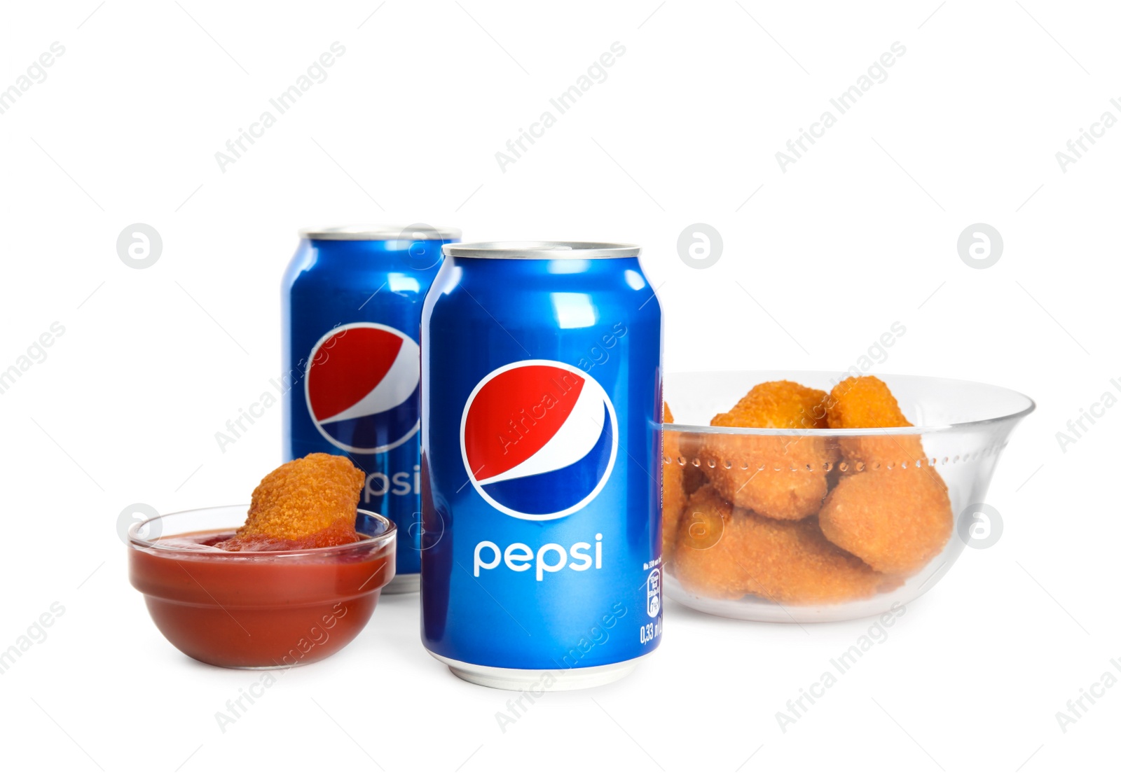 Photo of MYKOLAIV, UKRAINE - FEBRUARY 15, 2021: Cans of Pepsi and snack on white background