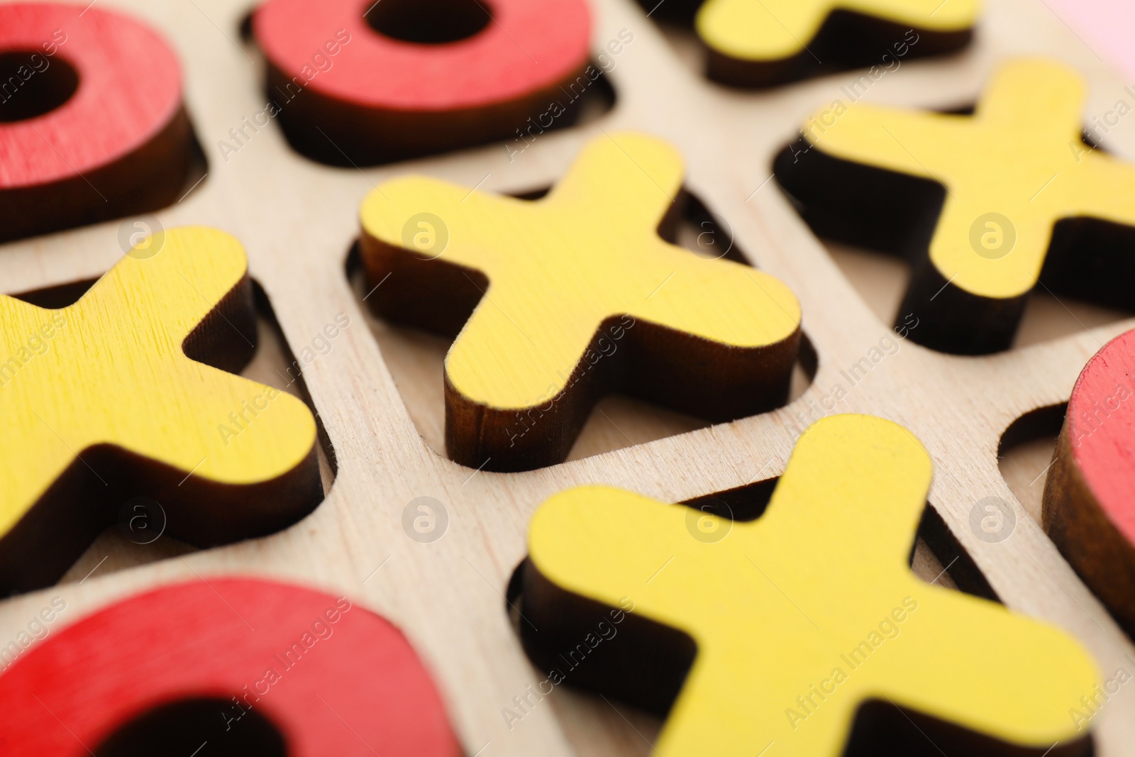 Photo of Tic tac toe wooden set as background, closeup