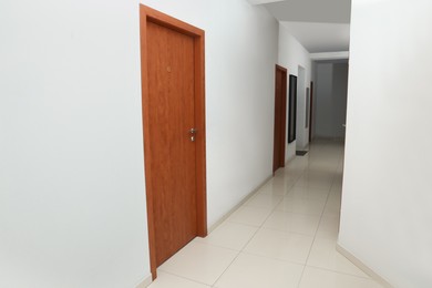 Photo of Modern empty office corridor with white walls