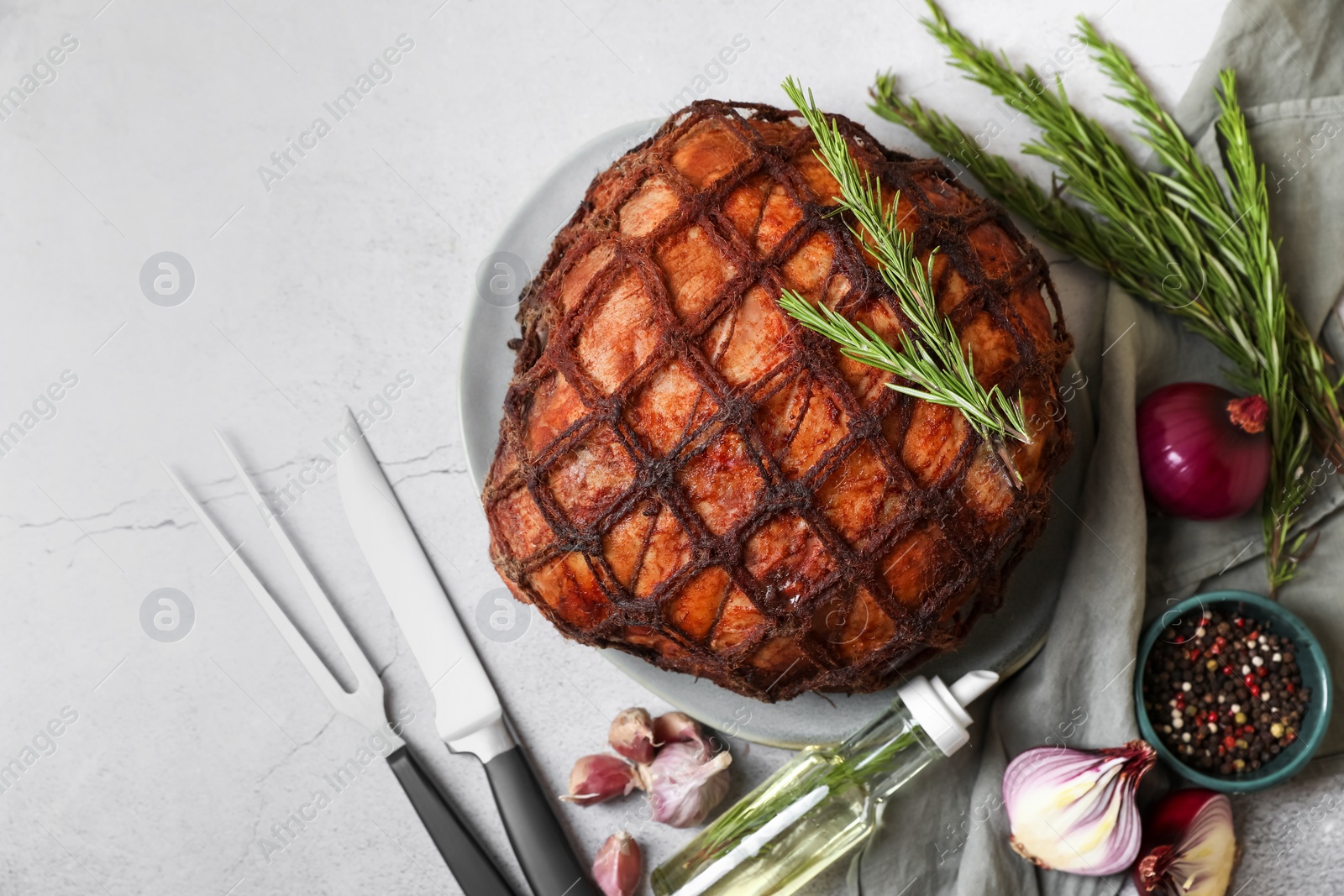 Photo of Delicious baked ham served on light grey table, flat lay