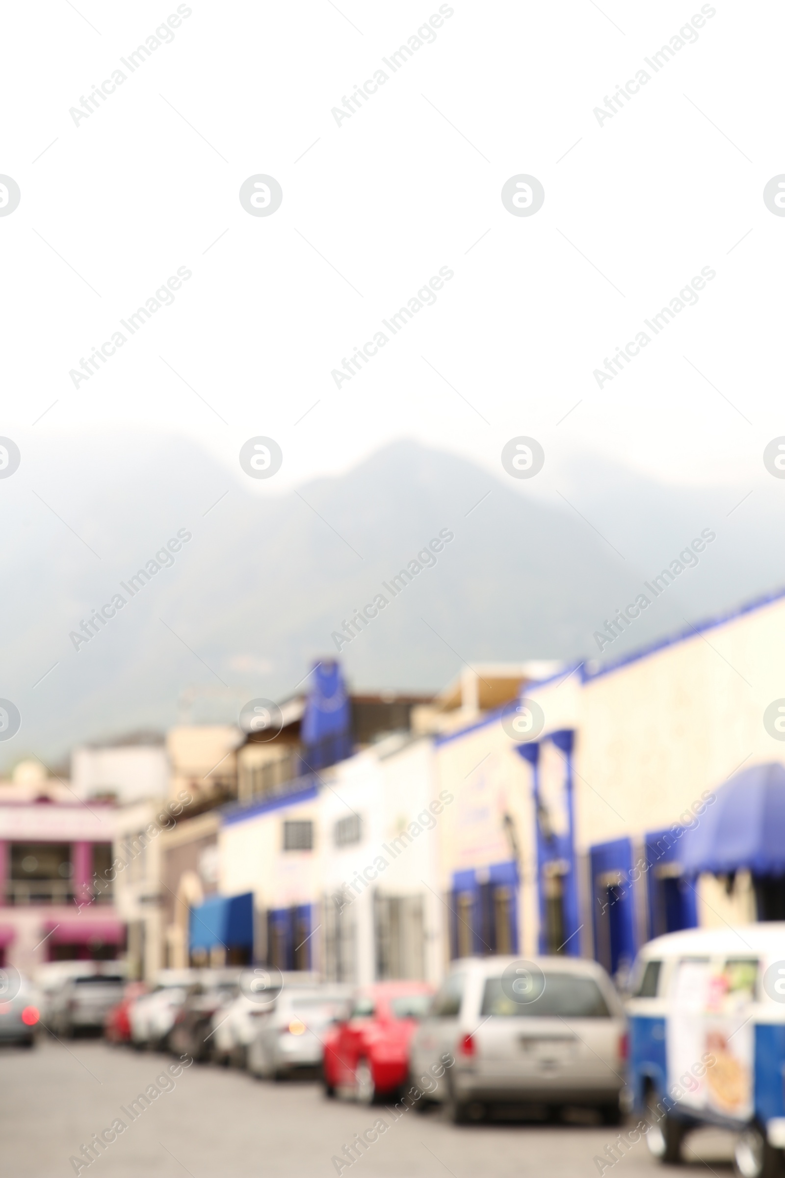 Photo of San Pedro Garza Garcia, Mexico – February 8, 2023: Blurred view of street with parked cars and beautiful buildings