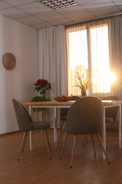 Window with stylish curtains in living room interior