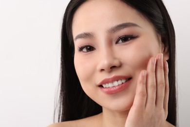 Portrait of beautiful woman on white background