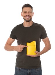 Photo of Man pointing at yellow container of motor oil on white background
