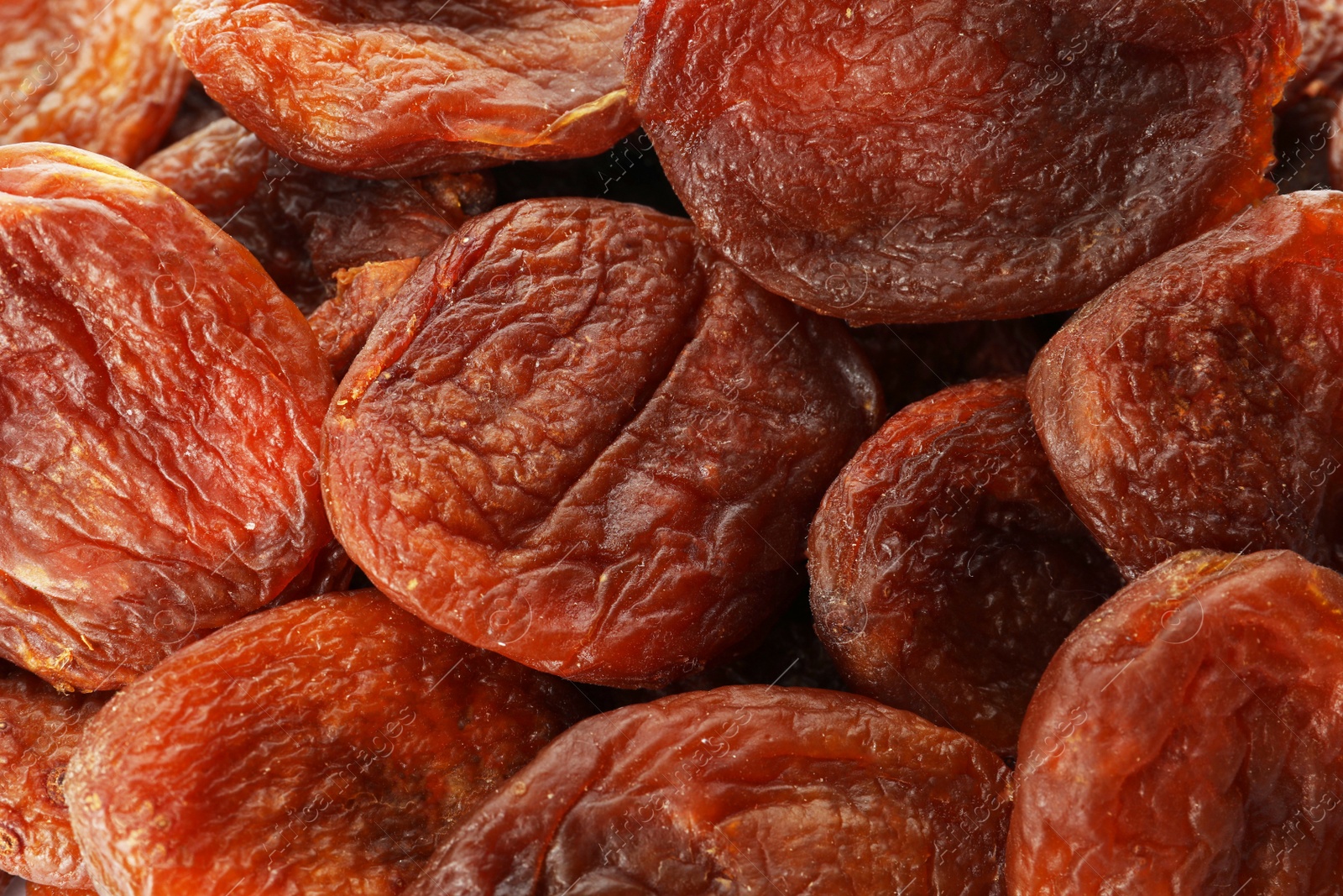 Photo of Tasty dried apricots as background, closeup. healthy snack