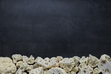 Cut fresh raw cauliflower on grey table, flat lay. Space for text