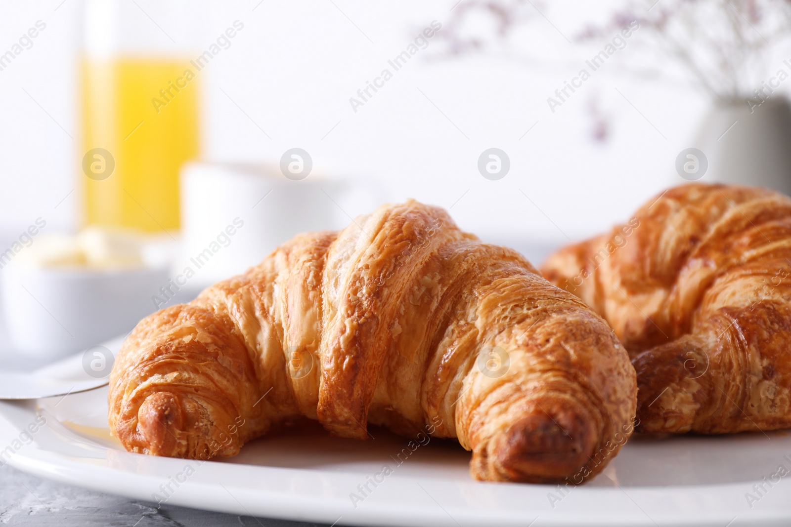 Photo of Tasty breakfast. Fresh croissants on table, closeup