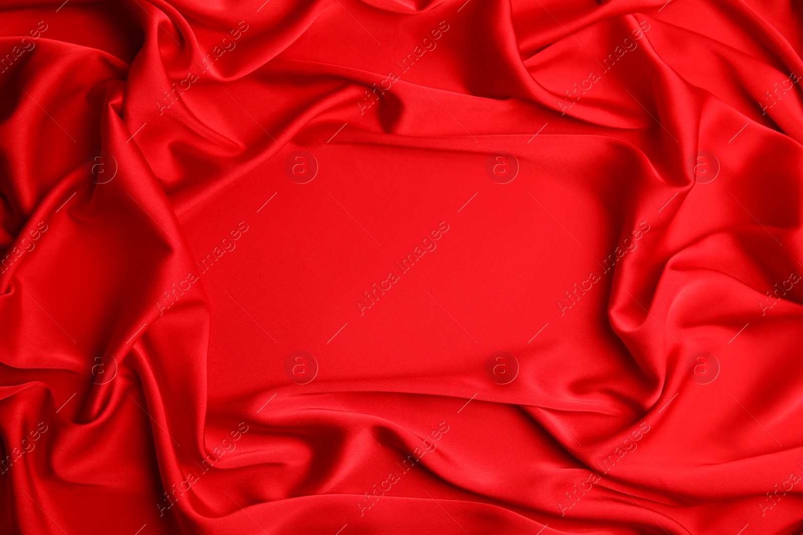 Photo of Texture of delicate red silk as background, top view