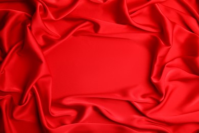 Texture of delicate red silk as background, top view