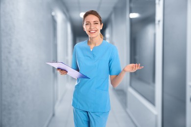 Nurse with clipboard in uniform at hospital