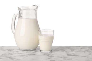 Glassware with tasty milk on marble table against white background