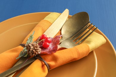 Thanksgiving day. Beautiful table setting and autumn decoration, closeup