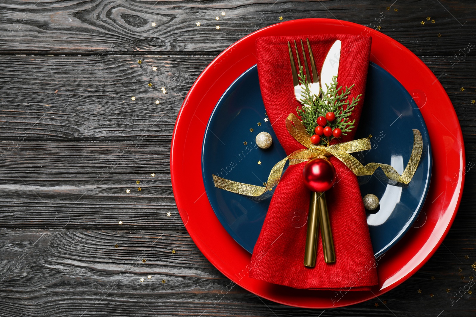 Photo of Beautiful Christmas table setting on wooden background, top view