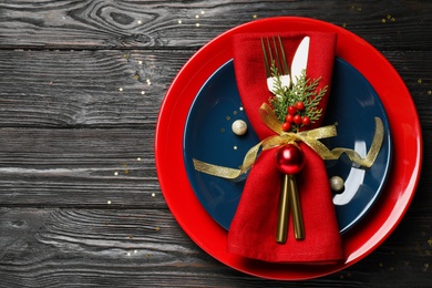 Beautiful Christmas table setting on wooden background, top view