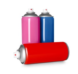 Photo of Colorful cans of spray paints on white background