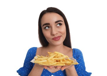 Beautiful young woman with French fries on white background