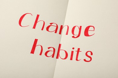 Photo of Paper sheet with text Change Habits, closeup