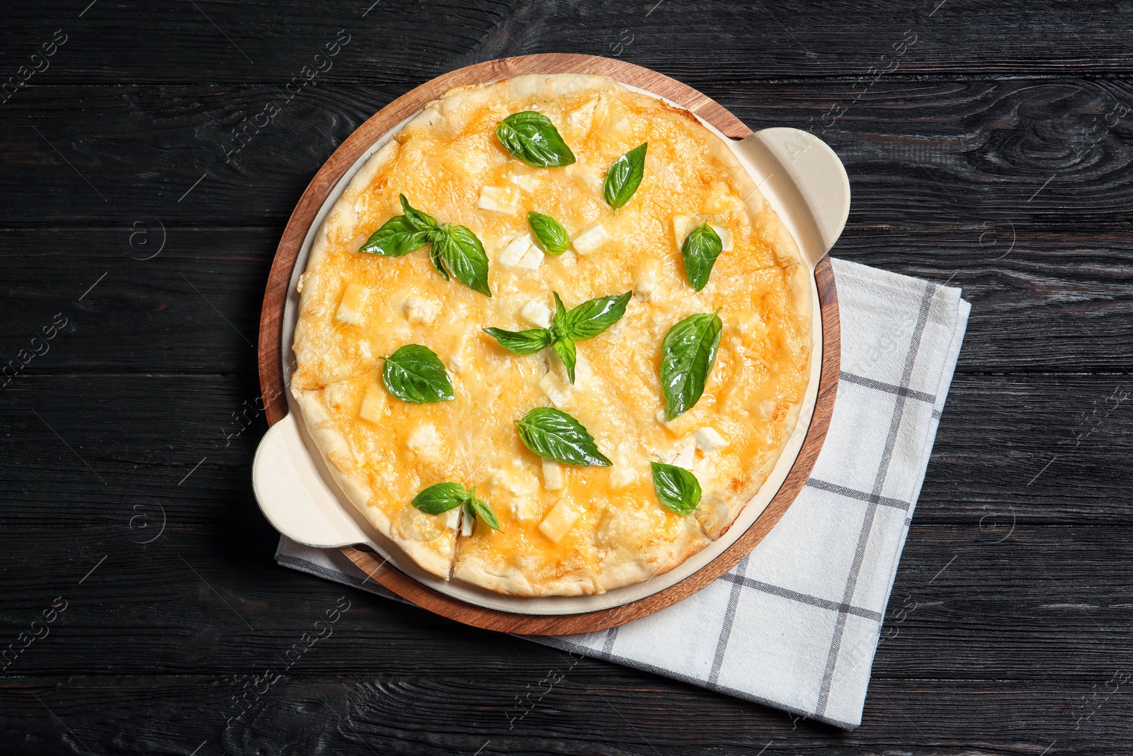 Photo of Fresh tasty homemade pizza on wooden background, top view