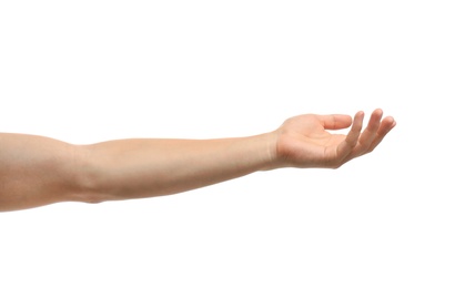 Photo of Young man held out hand on white background, closeup