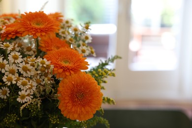 Photo of Fresh bouquet of chamomile and calendula flowers, closeup. Space for text