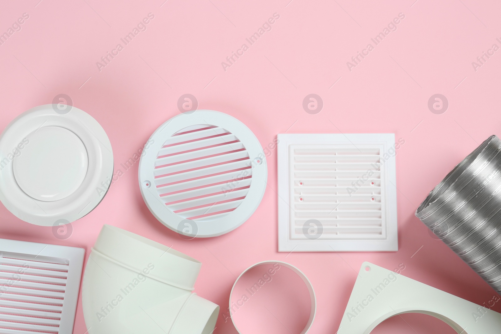 Photo of Parts of home ventilation system on pink background, flat lay. Space for text