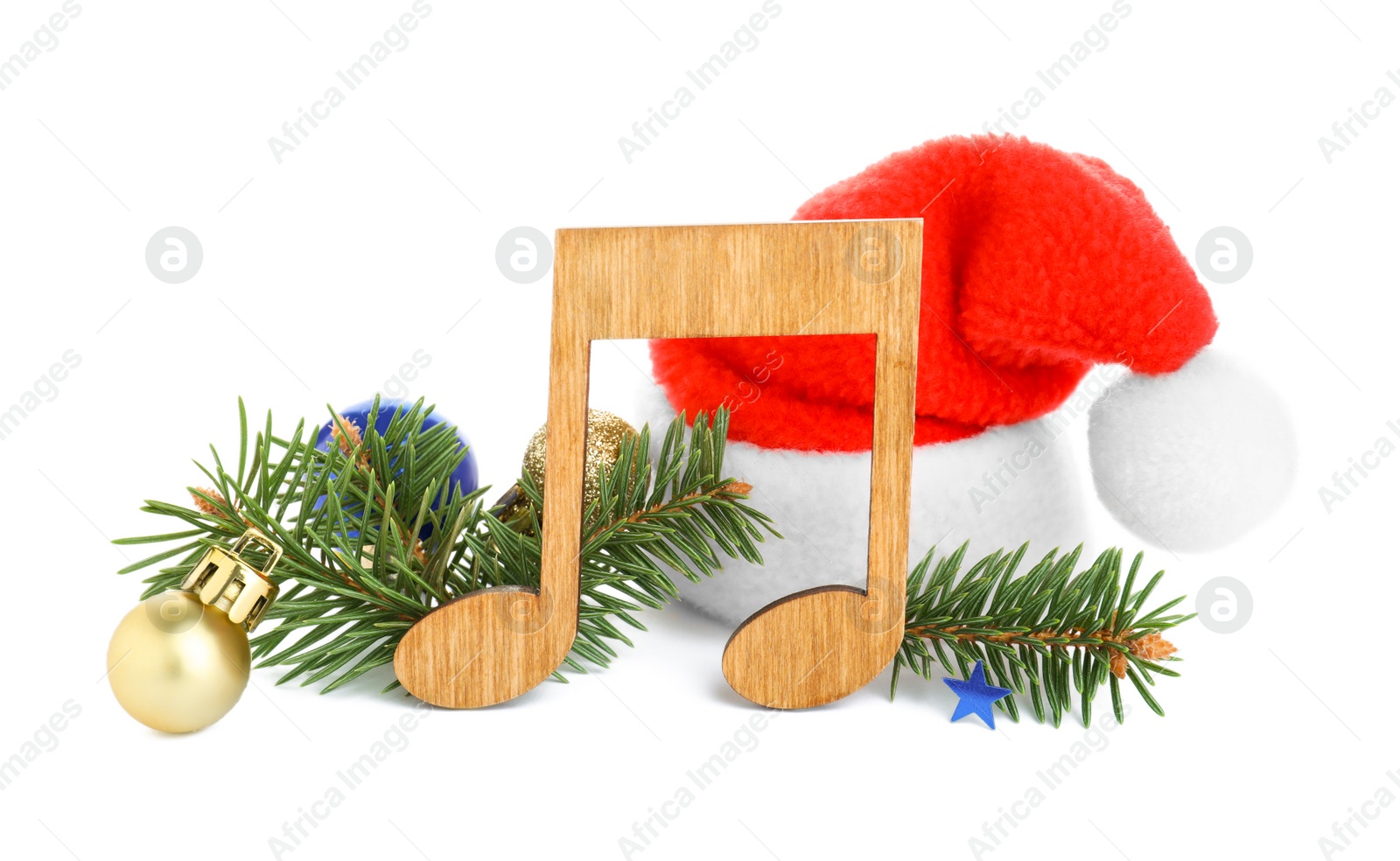 Photo of Wooden music note with Santa hat, fir tree branches and Christmas decor on white background