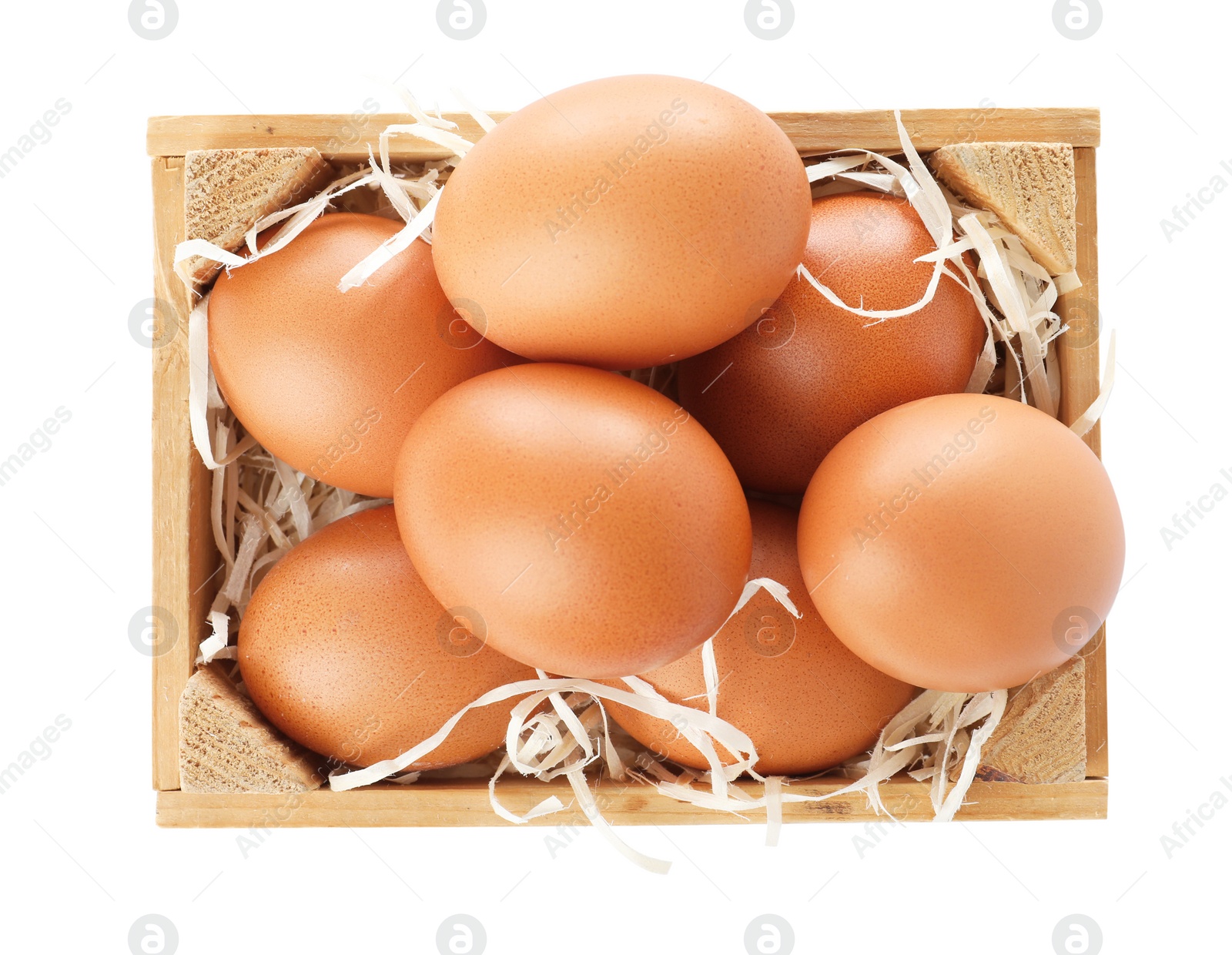 Photo of Wooden crate full of fresh eggs on white background, top view