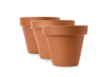 Stylish terracotta flower pots isolated on white