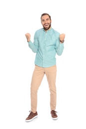 Photo of Young man celebrating victory on white background